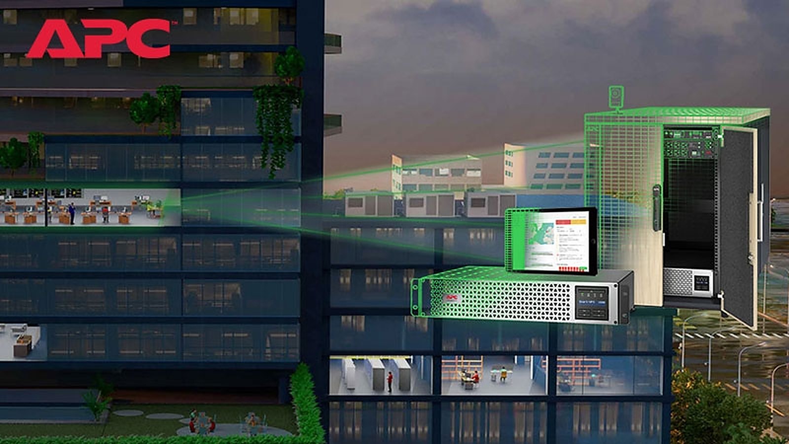 Edificio corporativo de noche con UPS y energía hacia cada piso — imagen oficial APC